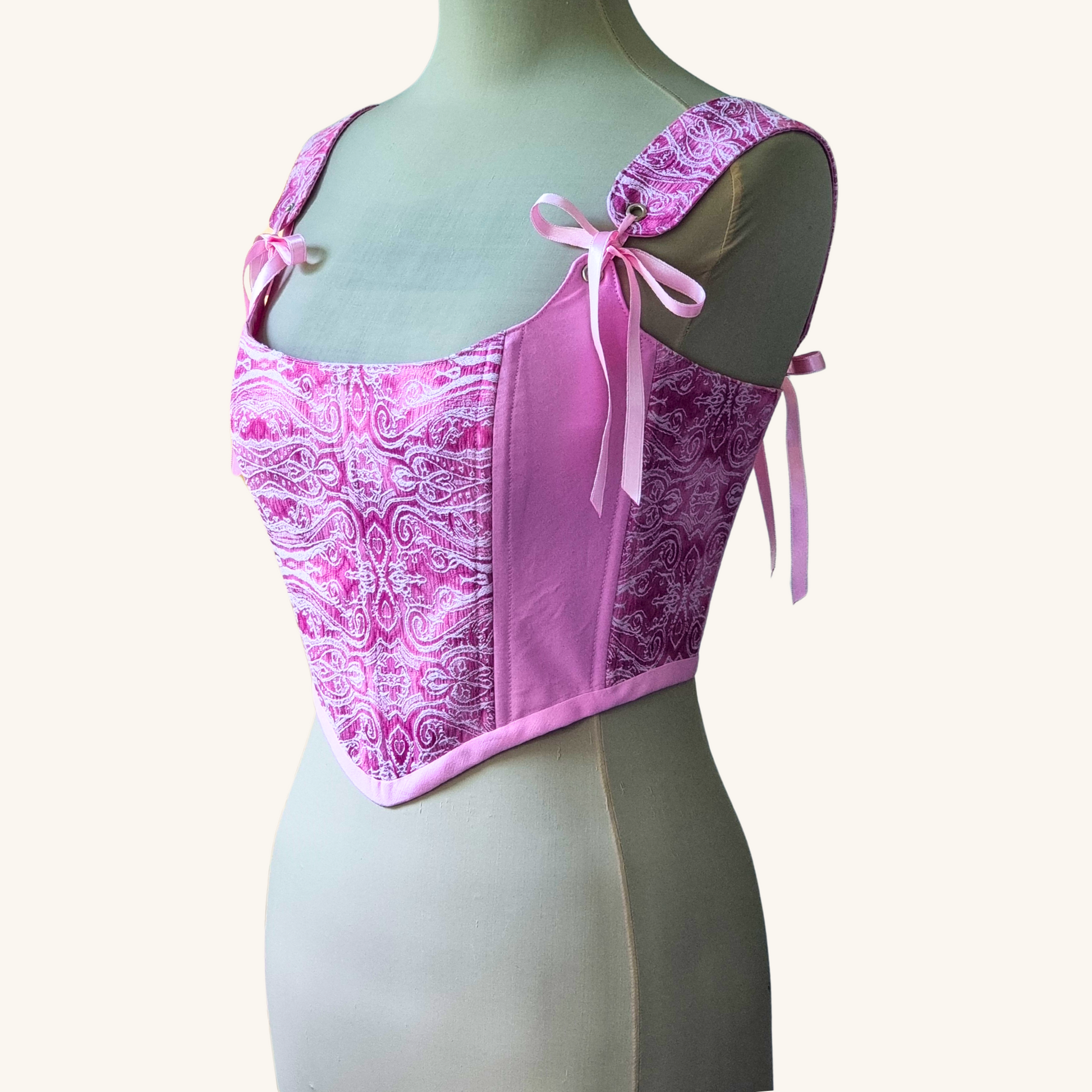 korset gledka otstrani na meneken rozov ruchno izraboten s rozovi sateneni pandelki ot pamuk i jakard i metalni kapsi 